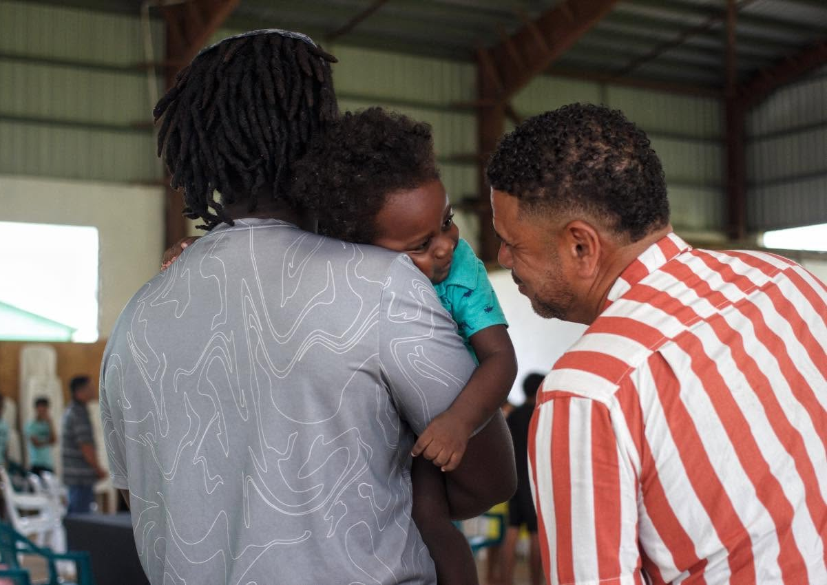 Church member greeting a child during a service