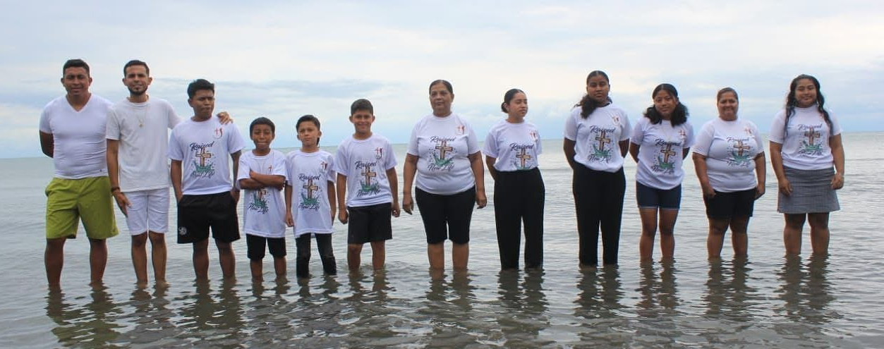 Newly baptized believers standing in the water